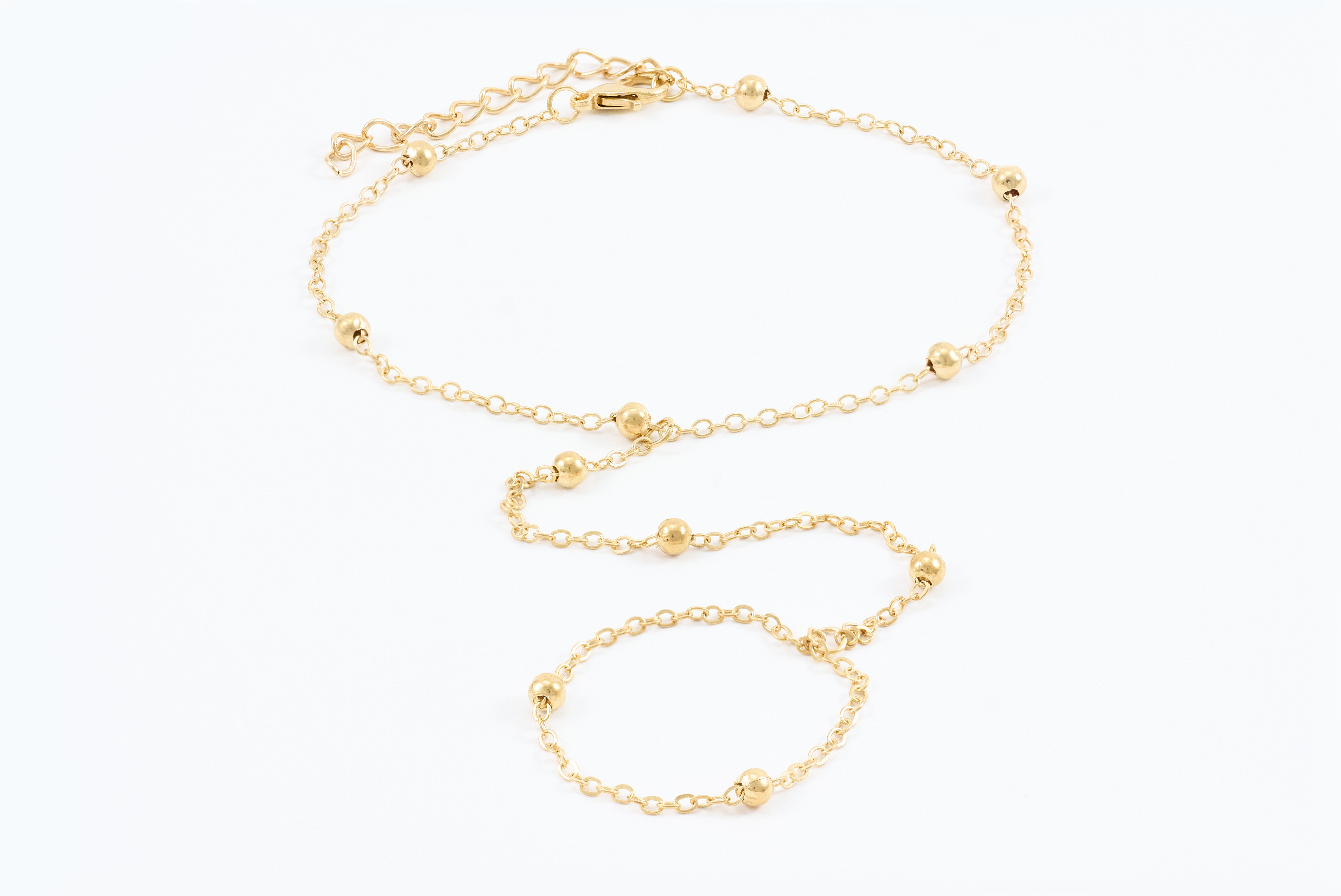 Gouden armband met klavertjes en kraaltjes