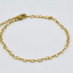 Gouden schakel-enkelband met bedeltjes