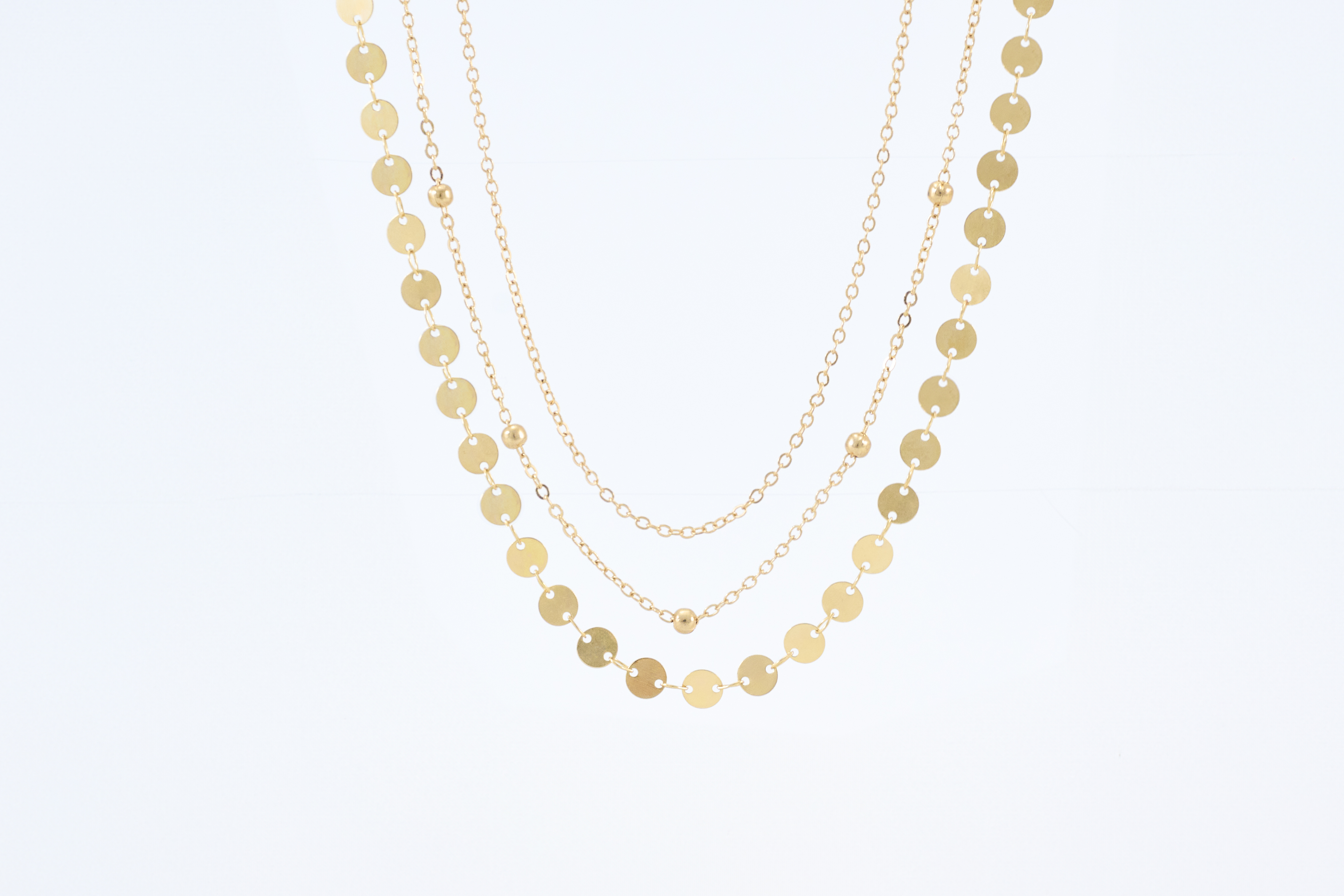 Lagenketting met gouden munten en schijfjes