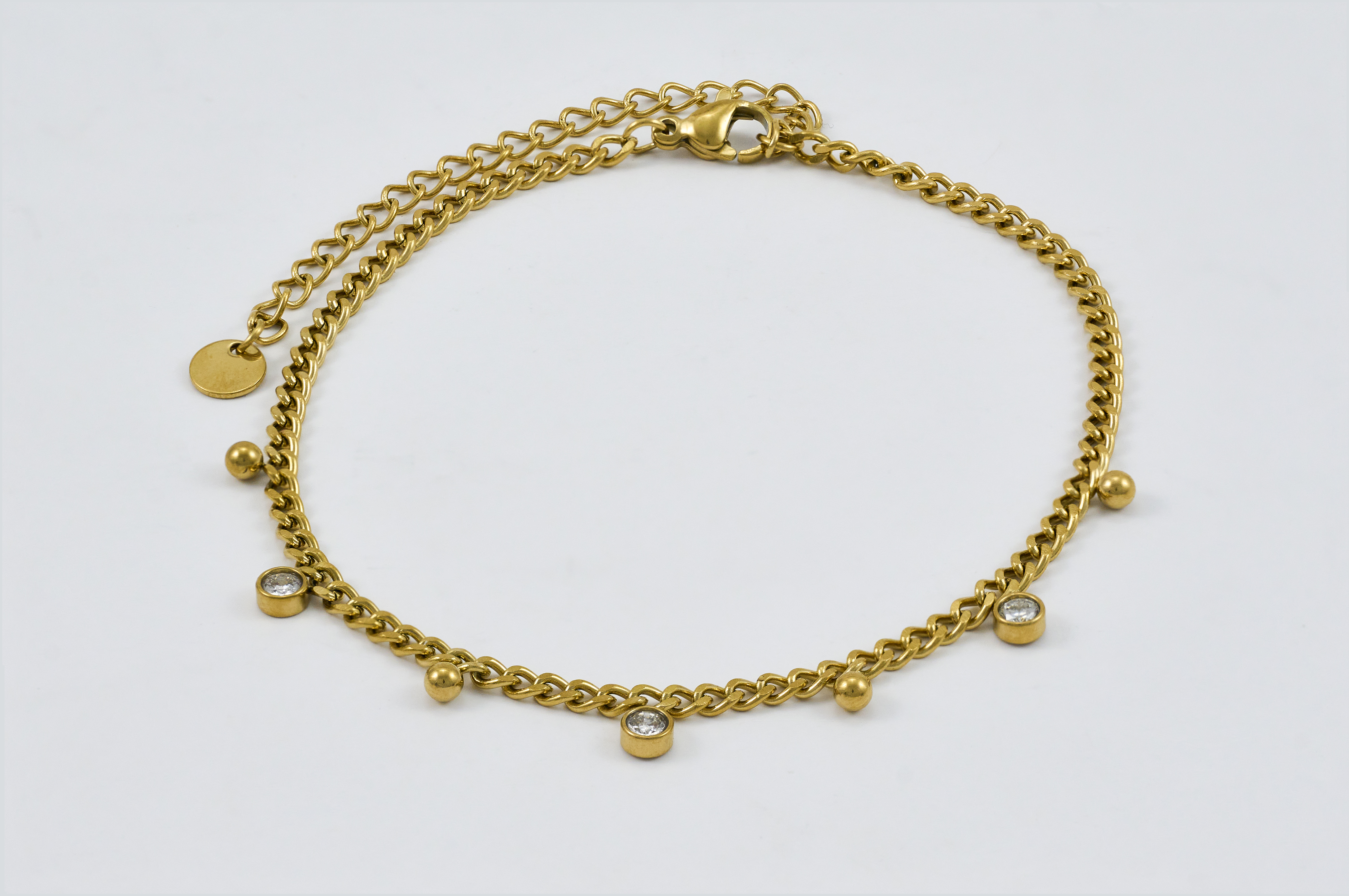 Luxe gouden enkelband met hangende bedels