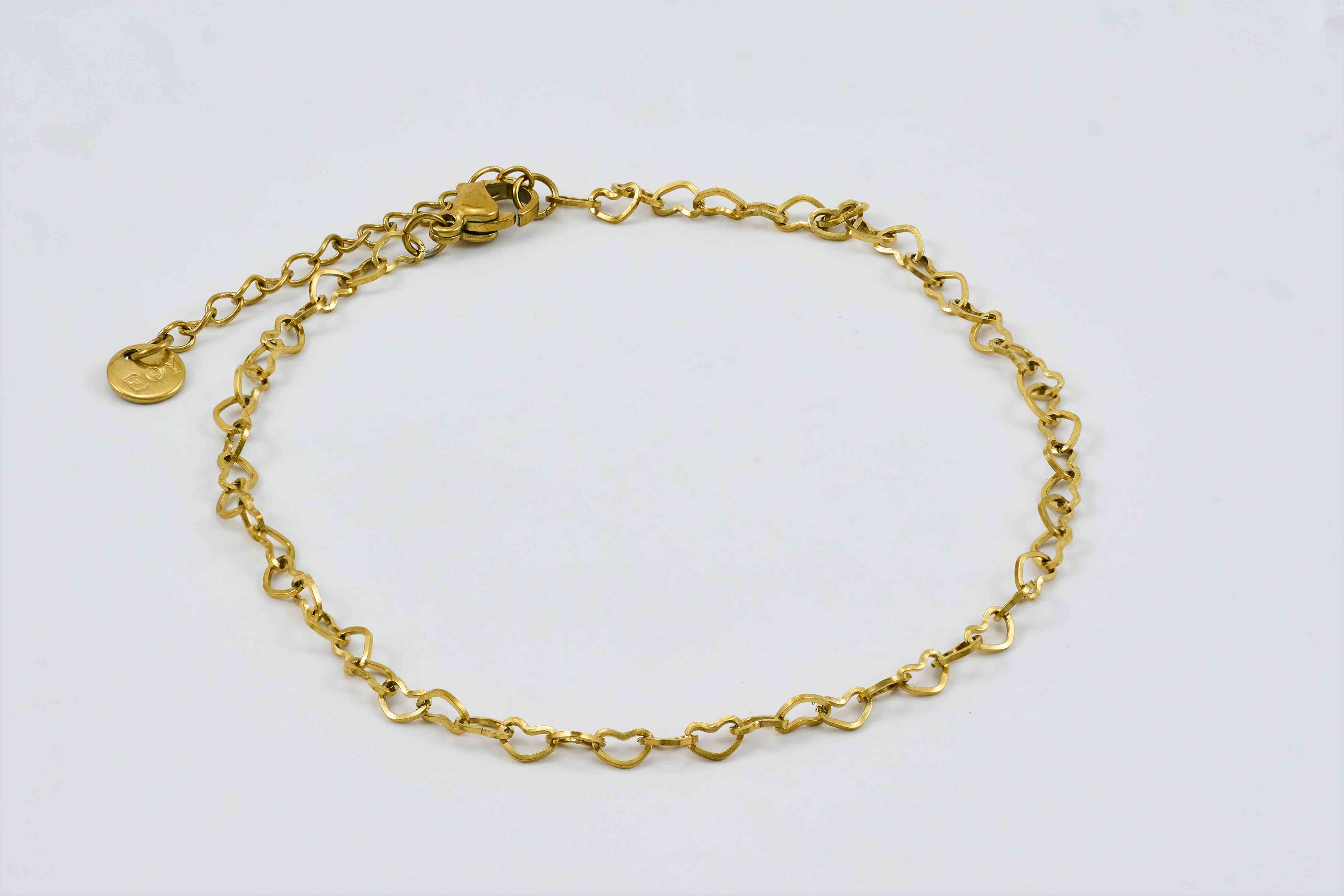 Gouden schakel-enkelband met bedeltjes