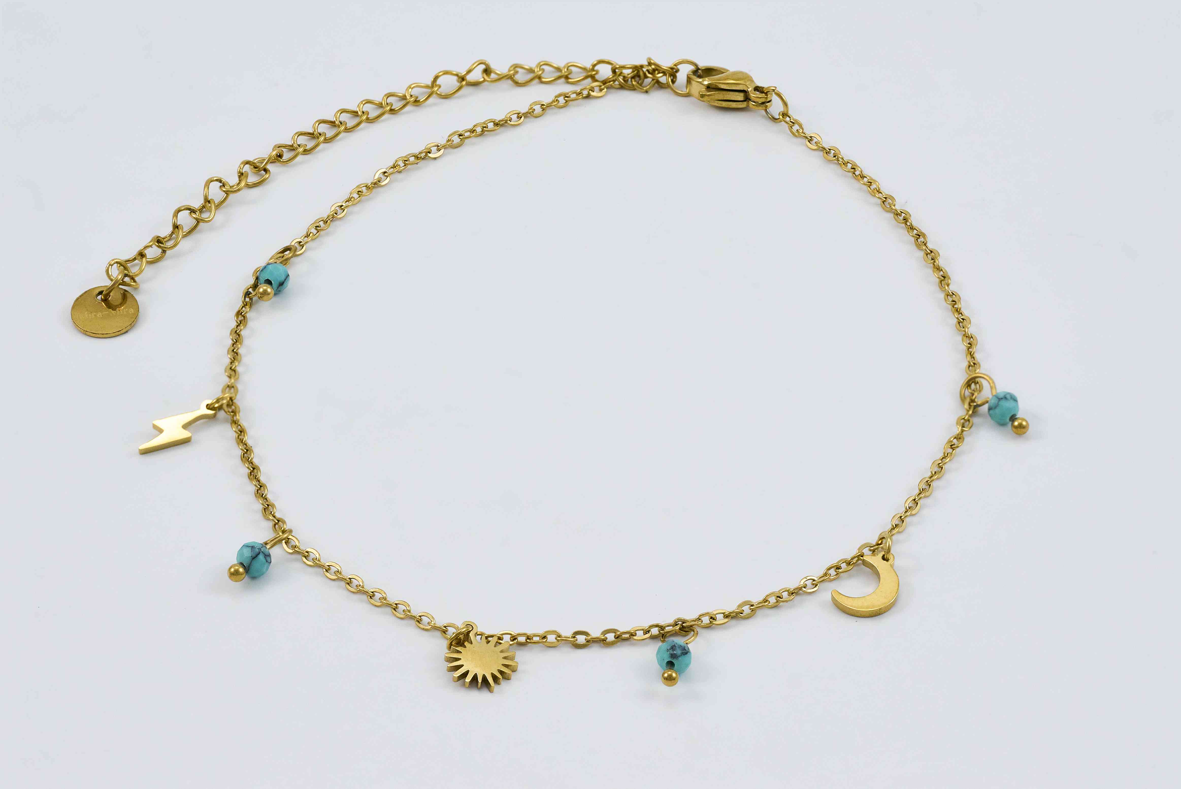 Minimalistische gouden enkelband met turquoise details