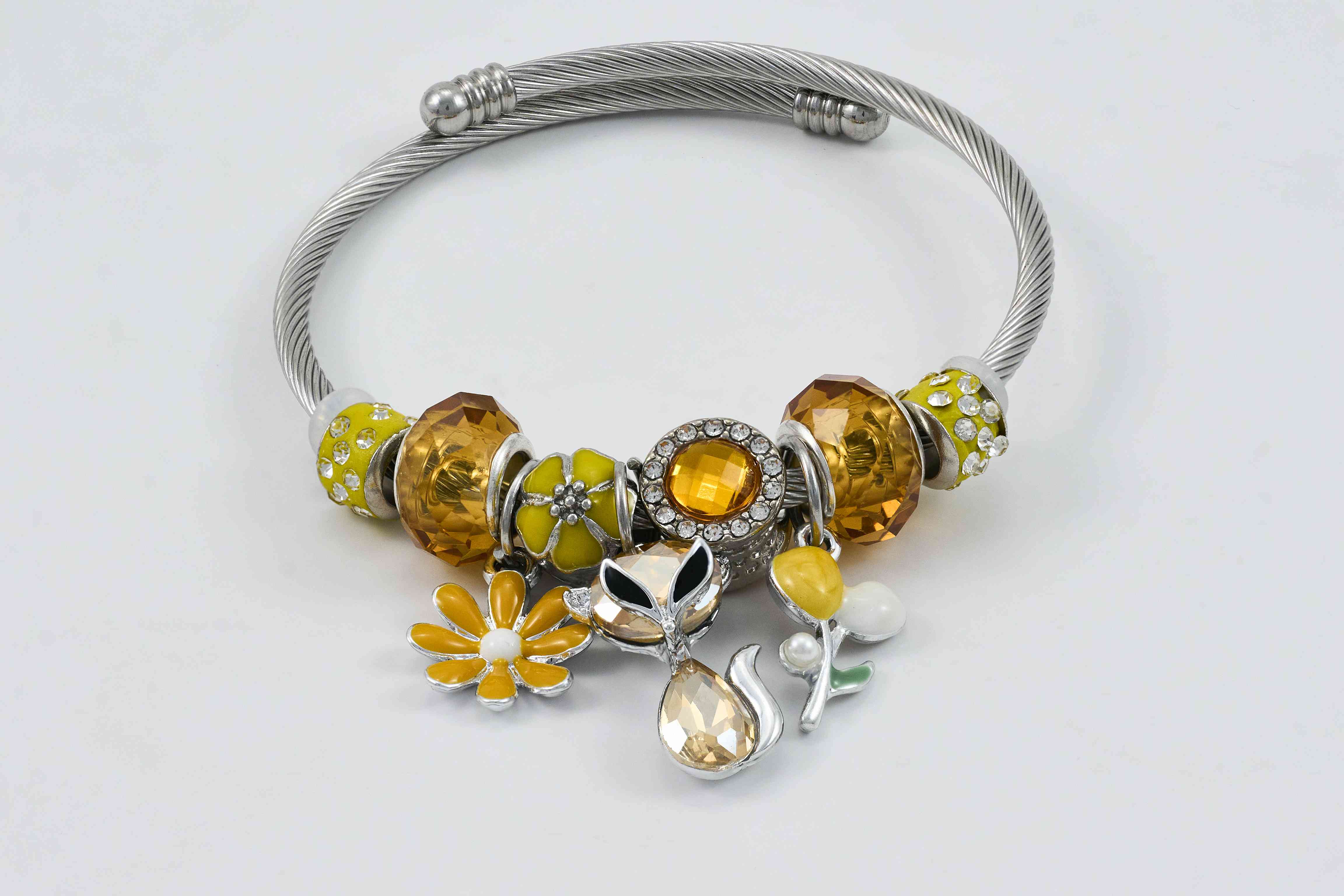 Zilveren armband met oranje en sprankelende steentjes